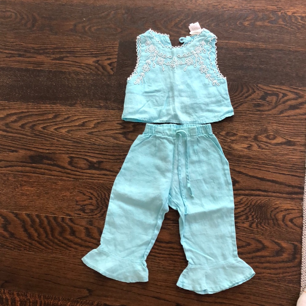 Light blue two piece set with white embroidery.